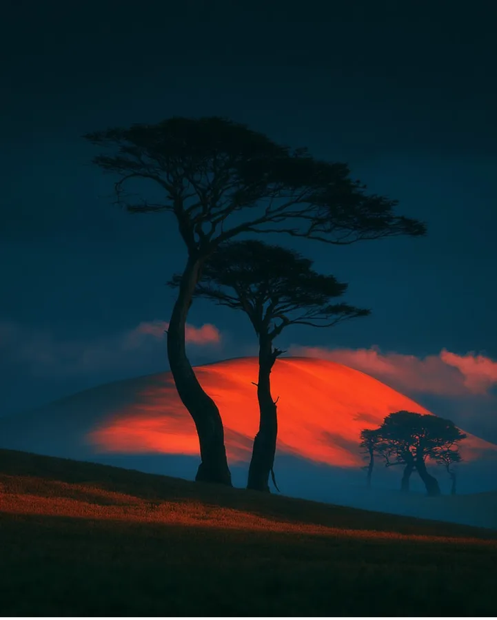 Artwork from Gautam Gehlot's portfolio — a glowing crimson hill at dusk